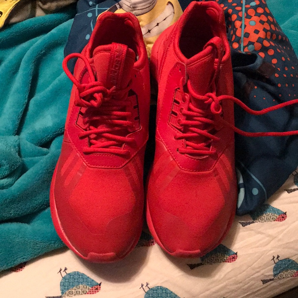 Red addidas tubulars